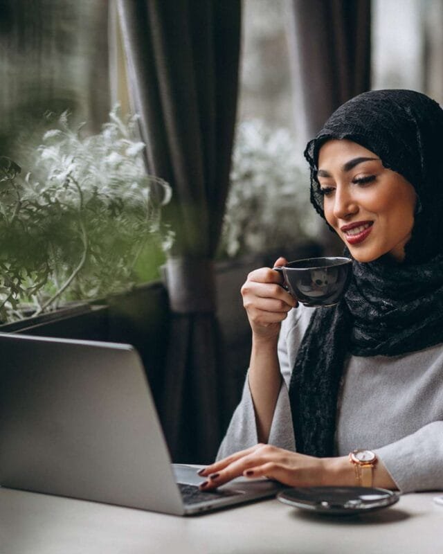 arabian-woman-hijab-inside-cafe-working-laptop